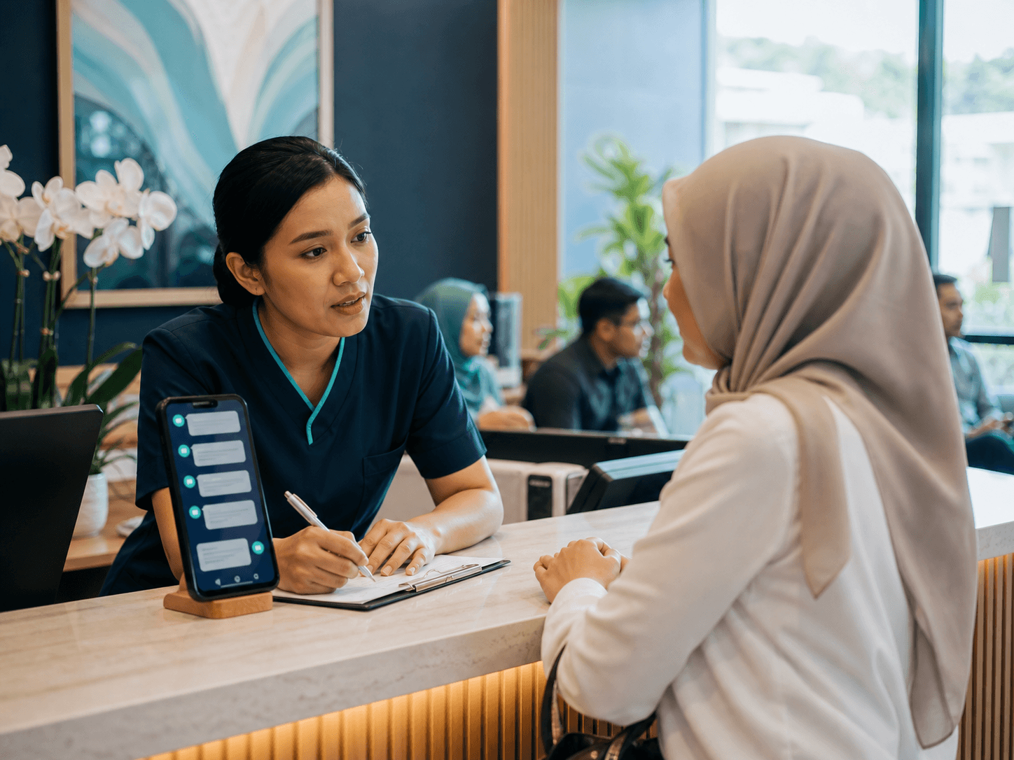 A busy wellness receptionist helping a visitor while customer messages wait on a phone